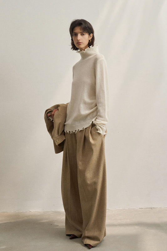 Pull en maille à col montant et franges