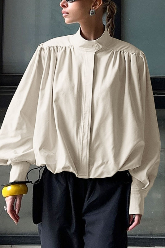 Veste chic à col haut et manches bouffantes