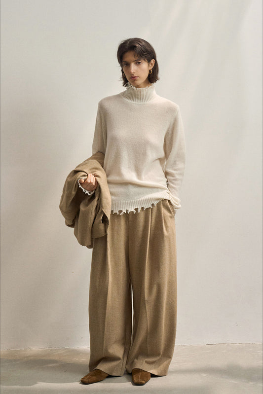 Pull en maille à col montant et franges