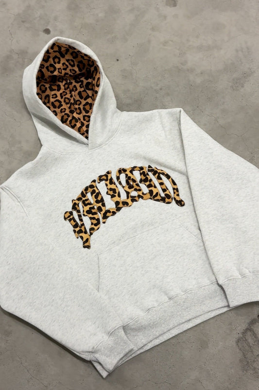 Sweat à capuche avec lettres brodées et doublure léopard