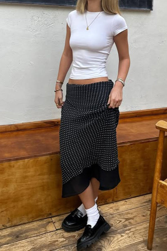 Jupe mi-longue trapèze en maille à pois