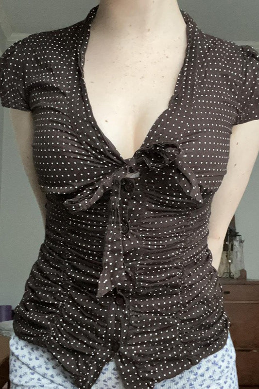 Chemisier à pois avec ceinture boutonnée et nouée à la taille