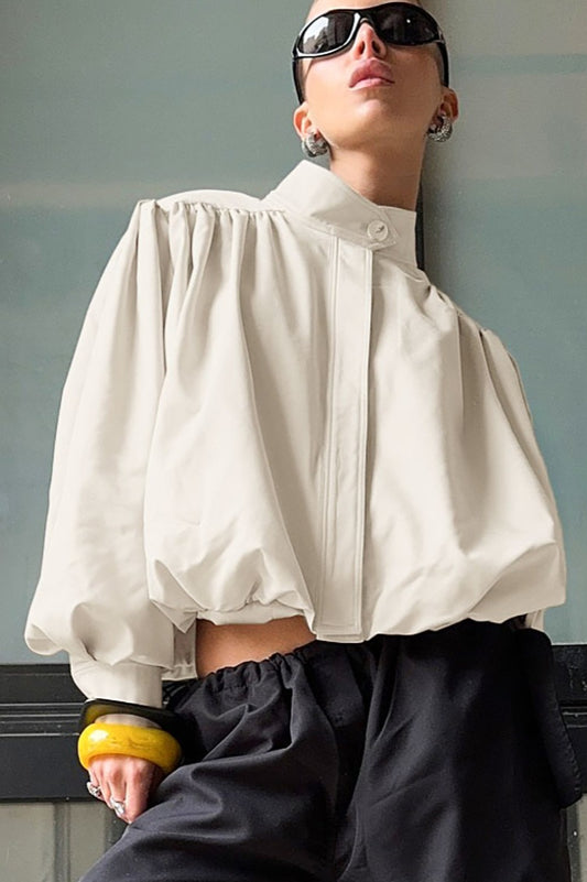 Veste chic à col haut et manches bouffantes