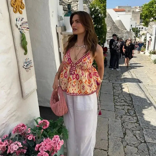 Haut court à bretelles et pompons brodés