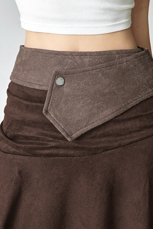 Jupe midi asymétrique de couleur unie