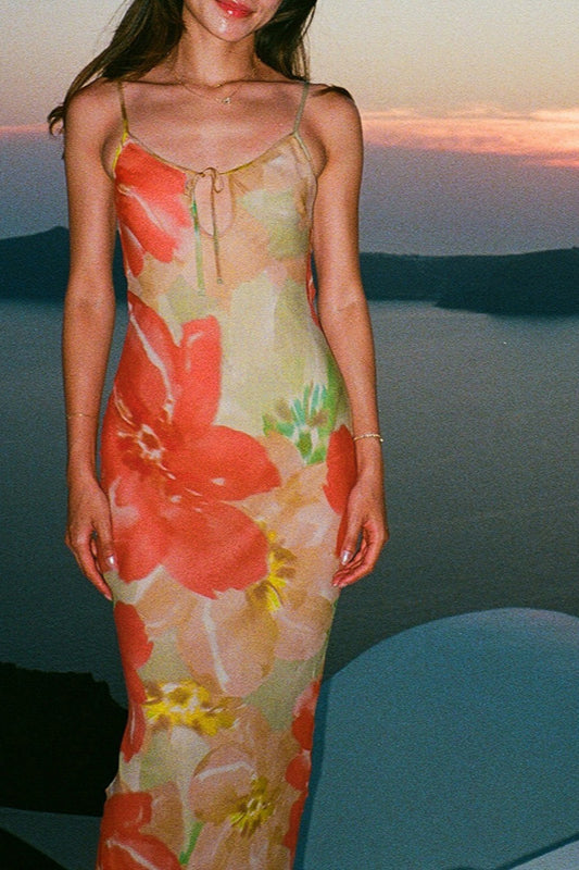 Robe longue caraco fleurie à découpes et lien dans le dos